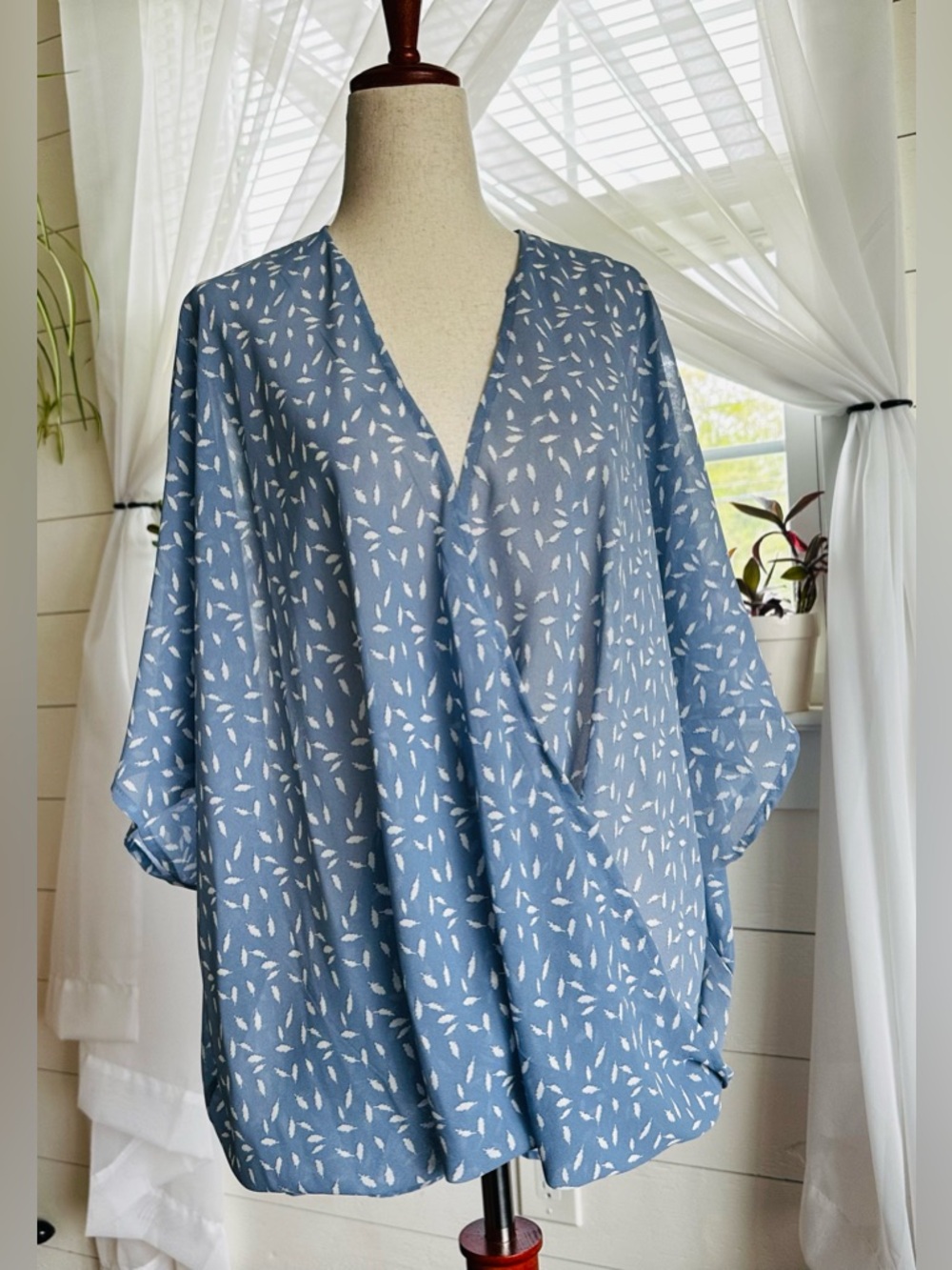 AAKAA coastal sheer surplice blouse. V-neck. Draped twisted front hem. 
Size: S